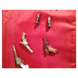 3 Miniature metal guns, 3 miniature metal guns in holsters with gems on butt of guns and 1975 custom cast metal historical figures