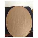 wood framed oval mirror with eagle etched on it