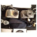 2 vintage cameras, manuals, straps, cords, and 2 rolls of vintage film