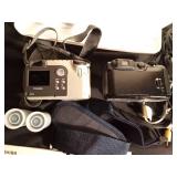 2 vintage cameras, manuals, straps, cords, and 2 rolls of vintage film