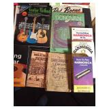 Music books- Mostly guitar and Harmonica playing
