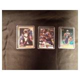 3 Kobe Bryant basketball cards in sleeves