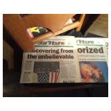 2 Magazine racks full of magazines and maps - Mad, mother earth news, Fur-fish game, Gopher Historian. Life, 911 newspapers and more