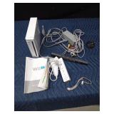 Wii with controllers and cords and manual