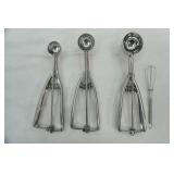 3 stainless steel scoops (different sizes) and 1 mini whisk
