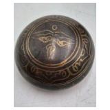 Bronze jar with rounded body and domed lid.