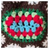 Vintage Crocheted Granny Square Afghan – Multicolor Oval Floral Motifs on Brown Ground