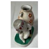 Occupied Japan Porcelain Figurine – Cherub Leaning on Vase with Flowers