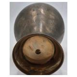 Bronze jar with rounded body and domed lid.