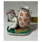 Occupied Japan Porcelain Figurine – Cherub Leaning on Vase with Flowers