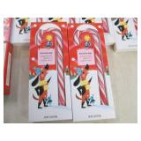 6 Jumbo candy canes and 6 gummy can...