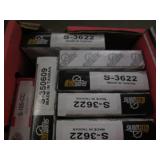 Car parts, spark plugs and emblems...