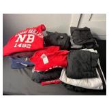 Red Nassau Bahamas NB 1492 Graphic Tee & Dockers Fleece Jacket & Assorted Hoodies in Laundry Basket