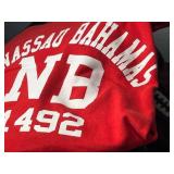 Red Nassau Bahamas NB 1492 Graphic Tee & Dockers Fleece Jacket & Assorted Hoodies in Laundry Basket