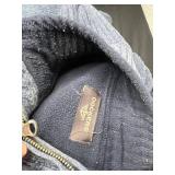 Red Nassau Bahamas NB 1492 Graphic Tee & Dockers Fleece Jacket & Assorted Hoodies in Laundry Basket