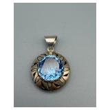 Blue Round Gem Pendant - Silver Halo with Leaf Motif, Bezel Set