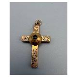 Gold-Tone Cross Pendant with Ornate Scrollwork and Green Stone Accent