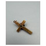 Gold-Tone Cross Pendant with Ornate Scrollwork and Green Stone Accent