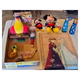 Disney Themed Toys and Accessories including Frozen Artwork, Mickey Mouse Plush Toys, and Water Bottles