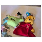 Assorted plush toys and dolls including Pound Puppies, Angry Birds, and more
