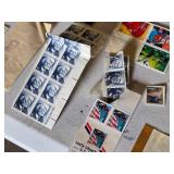 Collection of Vintage and Modern U.S. Postage Stamps Some Unmarked, Pile of Used