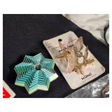 Assorted Household and Decorative Items including Coca-Cola Labels, Crystal Heart Trinket, and Butterfly Hair Clips