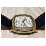 Skagen Denmark 558SGLD8A Crystal-Bezel Gold Tone Watch & Black Leather Strap