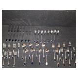 Vintage Fürst Besteck Flatware (Silverware) set in the "Happy Day" pattern, featuring unique dark, rounded handles.