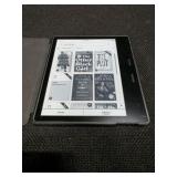 Amazon Kindle Oasis e-reader with a Fintie Origami case