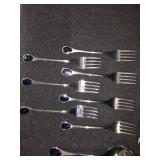 Vintage Fürst Besteck Flatware (Silverware) set in the "Happy Day" pattern, featuring unique dark, rounded handles.