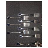 Vintage Fürst Besteck Flatware (Silverware) set in the "Happy Day" pattern, featuring unique dark, rounded handles.