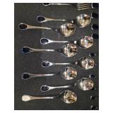 Vintage Fürst Besteck Flatware (Silverware) set in the "Happy Day" pattern, featuring unique dark, rounded handles.