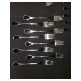 Vintage Fürst Besteck Flatware (Silverware) set in the "Happy Day" pattern, featuring unique dark, rounded handles.