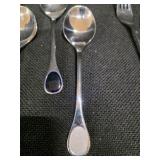 Vintage Fürst Besteck Flatware (Silverware) set in the "Happy Day" pattern, featuring unique dark, rounded handles.