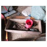 Contents of corner including buckets, a wood barrel, tar paper, motor and more