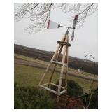 Windmill on a rustic wood stand...
