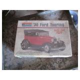 1904 Metal cabinet and 30 Ford Must...