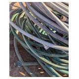Large Pile of Garden Hoses