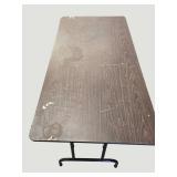 Stylish black table with a sturdy wood-like surface and chic metal legs, measuring 59.5 x 30 inches.