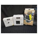Assorted Wasserstein Home Security Products, Solar Charger, Alarm Clock Camera Case and Pogo Pin Cable and Adapter