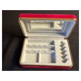 Vintage assorted earrings and jewelry components in red velvet box