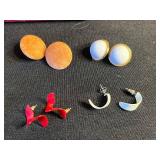 Vintage assorted earrings and jewelry components in red velvet box