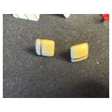 Vintage assorted earrings and jewelry components in red velvet box