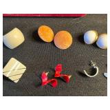 Vintage assorted earrings and jewelry components in red velvet box