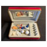 Vintage assorted earrings and jewelry components in red velvet box
