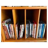 DVD Collection - Assorted Movies & TV Titles on Wooden Shelf
