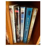 DVD Collection - Assorted Movies & TV Titles on Wooden Shelf