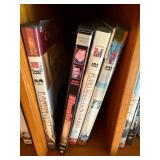 DVD Collection - Assorted Movies & TV Titles on Wooden Shelf