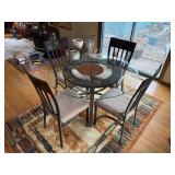 Round Glass Dining Table & 4 Cushioned Metal Chairs - rug not inc
