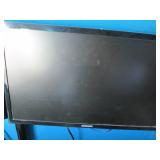 Pair of Samsung monitors with a sta...